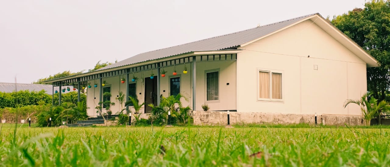 Farmhouse exterior with hanging planters